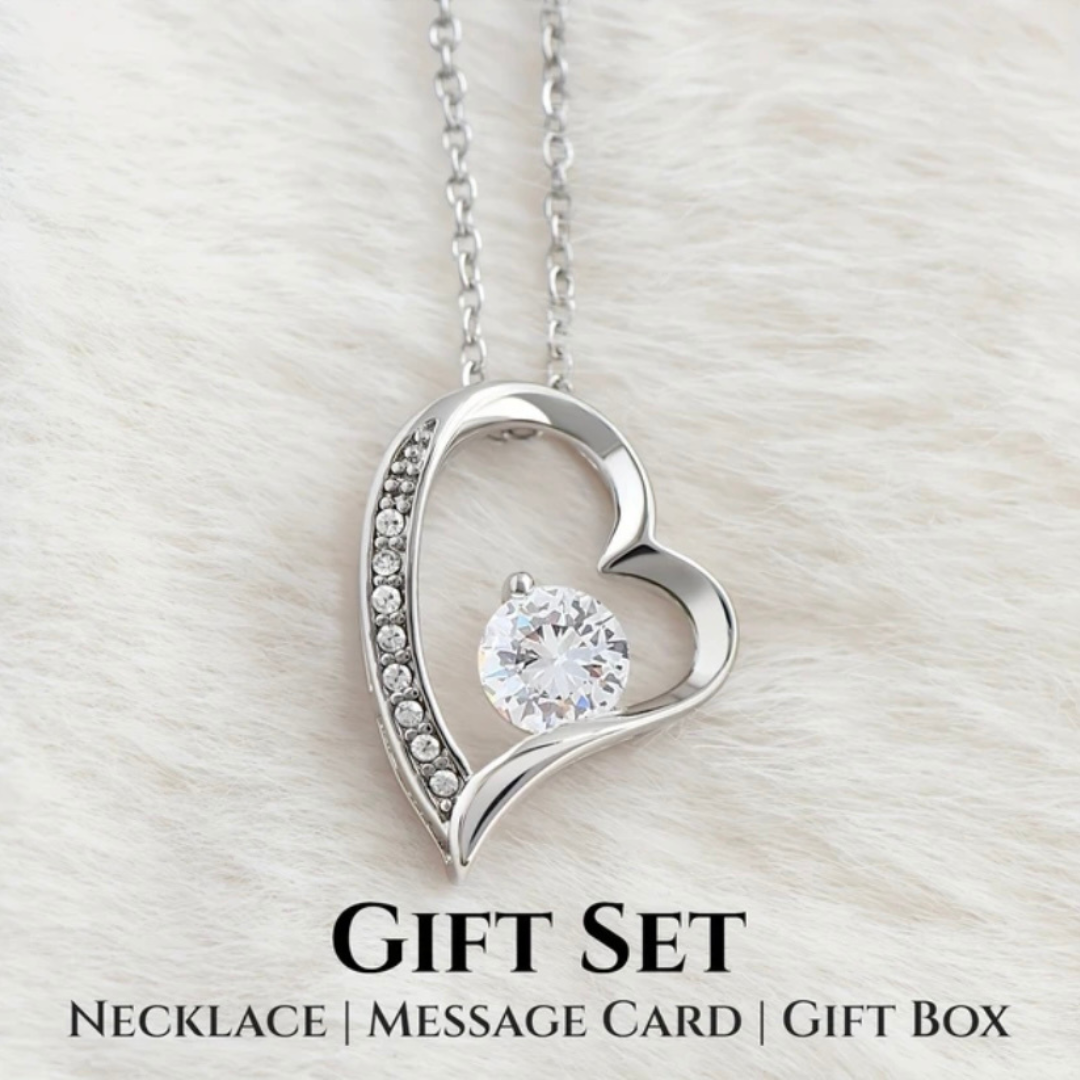 Heart Pendant For Mom-Affordable silver heart-shaped pendant necklace with clear cubic zirconia gemstone in an open frame, available in Canada. Minimalist jewelry design in a gift box with a heartfelt message and floral accents, perfect for gifting.